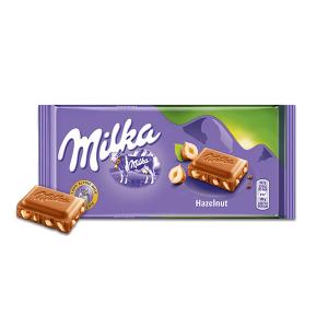 Šokoladas MILKA, su skaldytais lazdyno riešutais, 100 g